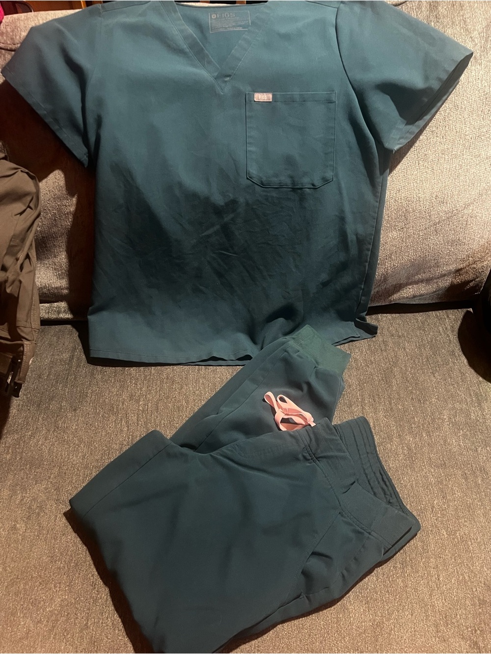 Figs womenโs dark green Jogger-Style Scrub top and Pants